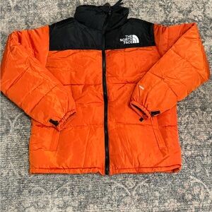 The North Face Puffer Jacket in Orange and Black